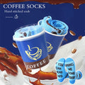 1 pair of mid-calf socks for men and women in a novelty coffee design, practical and suitable for holiday gifting.